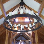20 light electrified chandelier with fleur de lis escutcheon and round frame.