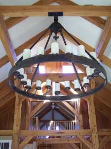 20 light electrified chandelier with fleur de lis escutcheon and round frame.